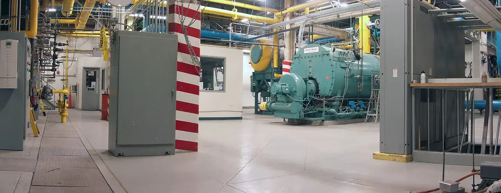 Industrial boiler room with piping and manifolds