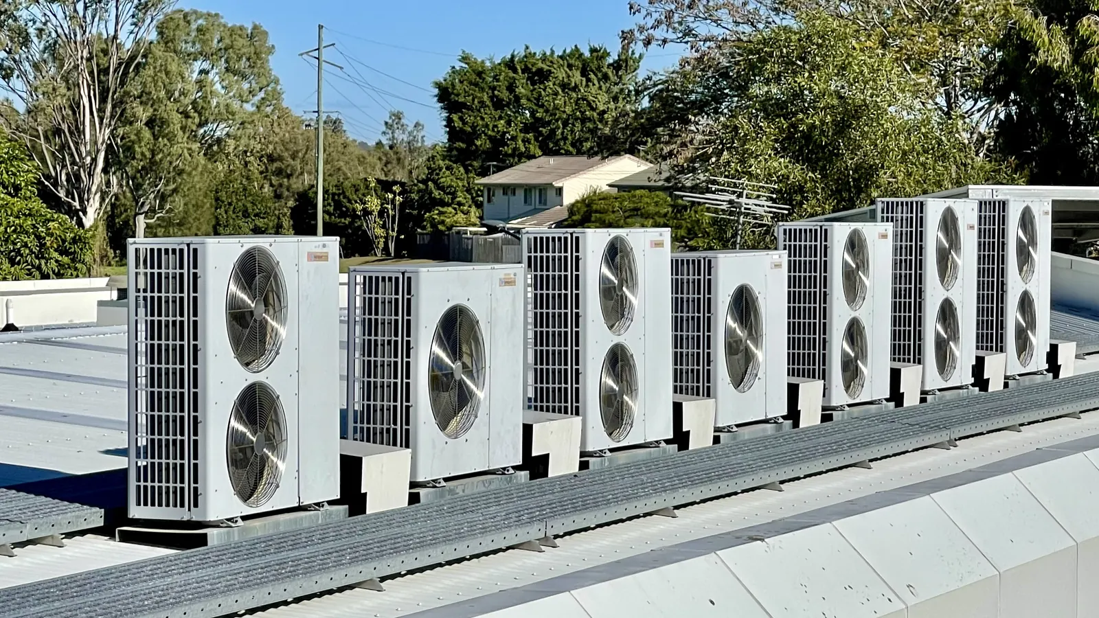 A row of air conditioning condensing units on a hospital roof, the kind of equipment commercial HVAC financing pays for